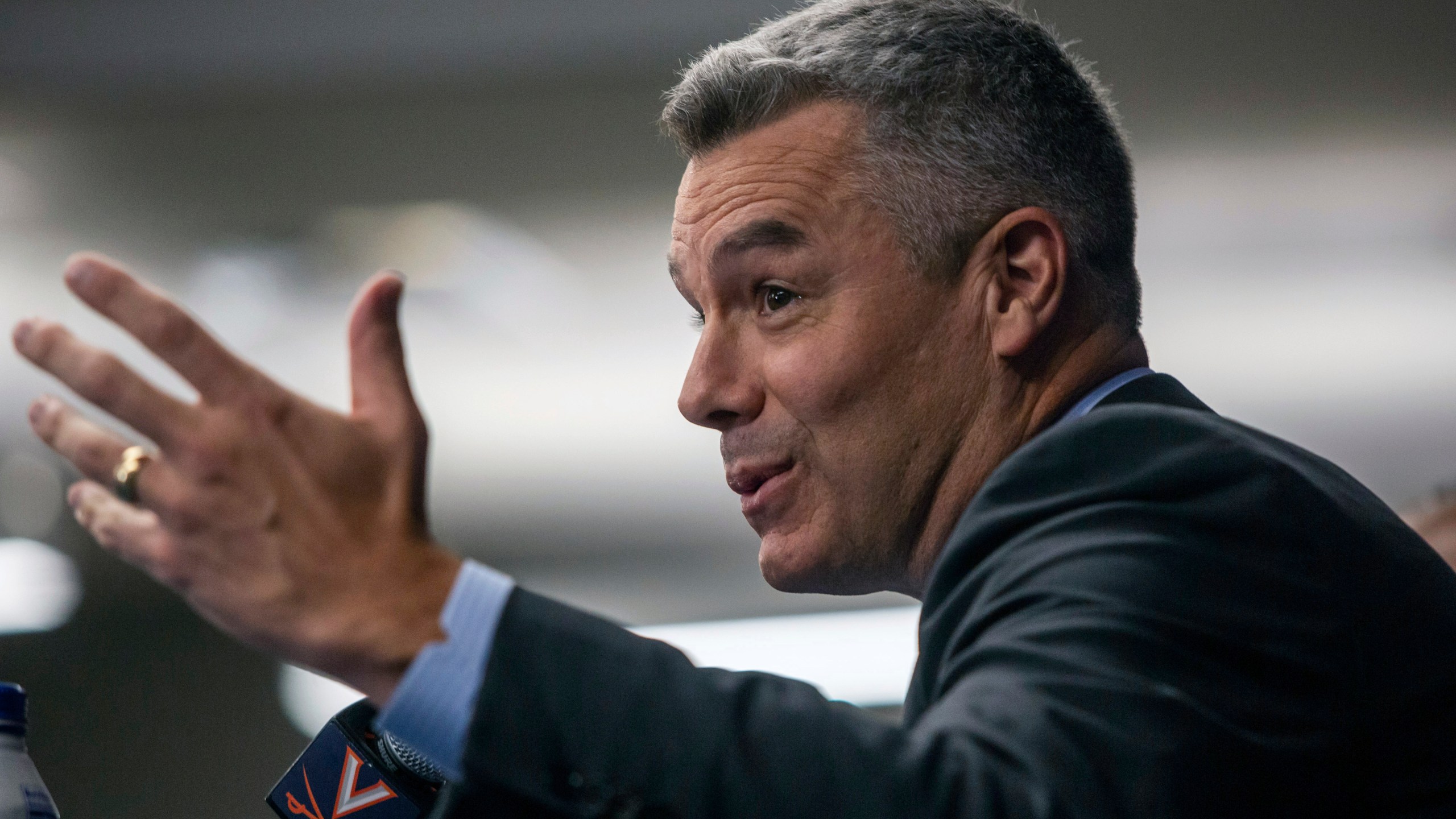 Virginia NCAA college basketball coach Tony Bennett announces his retirement as athletic director Carla Willliams looks on during a press conference in Charlottesville, Va., Friday, Oct. 18, 2024. (Cal Cary/The Daily Progress via AP)