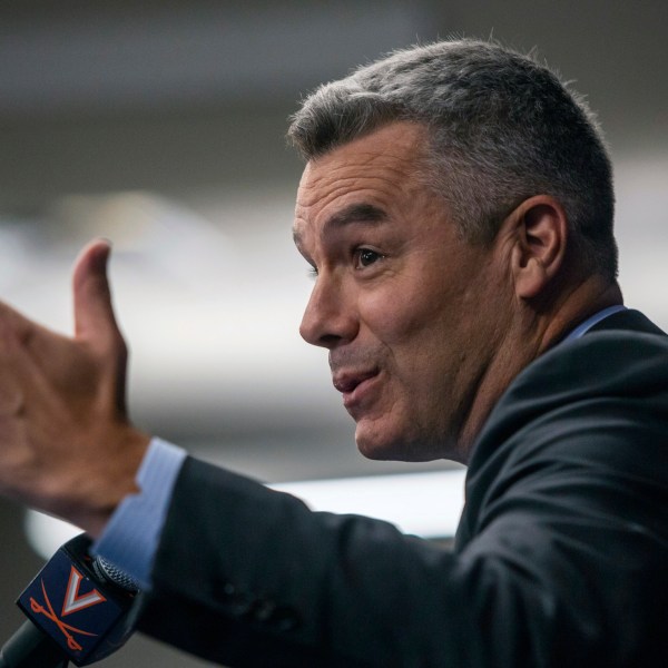 Virginia NCAA college basketball coach Tony Bennett announces his retirement as athletic director Carla Willliams looks on during a press conference in Charlottesville, Va., Friday, Oct. 18, 2024. (Cal Cary/The Daily Progress via AP)