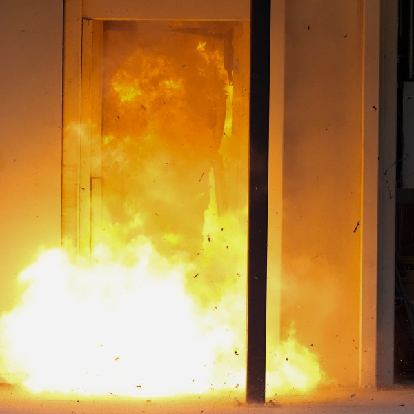 A U.S. special forces soldier sets off a traditional explosive charge that's noticeably larger then recently-developed breaching charges, Thursday, Sept. 19, 2024, at at Fort Liberty in Fayetteville, N.C. A U.S. special forces soldier sets off a reshaped explosive charge that's noticeably smaller to reduce its blowback on troops, Thursday, Sept. 19, 2024, at at Fort Liberty in Fayetteville, N.C. Special Operations Command is developing ways to better protect warfighters and evaluate their health risks, particularly during training. (AP Photo/Chris Carlson)