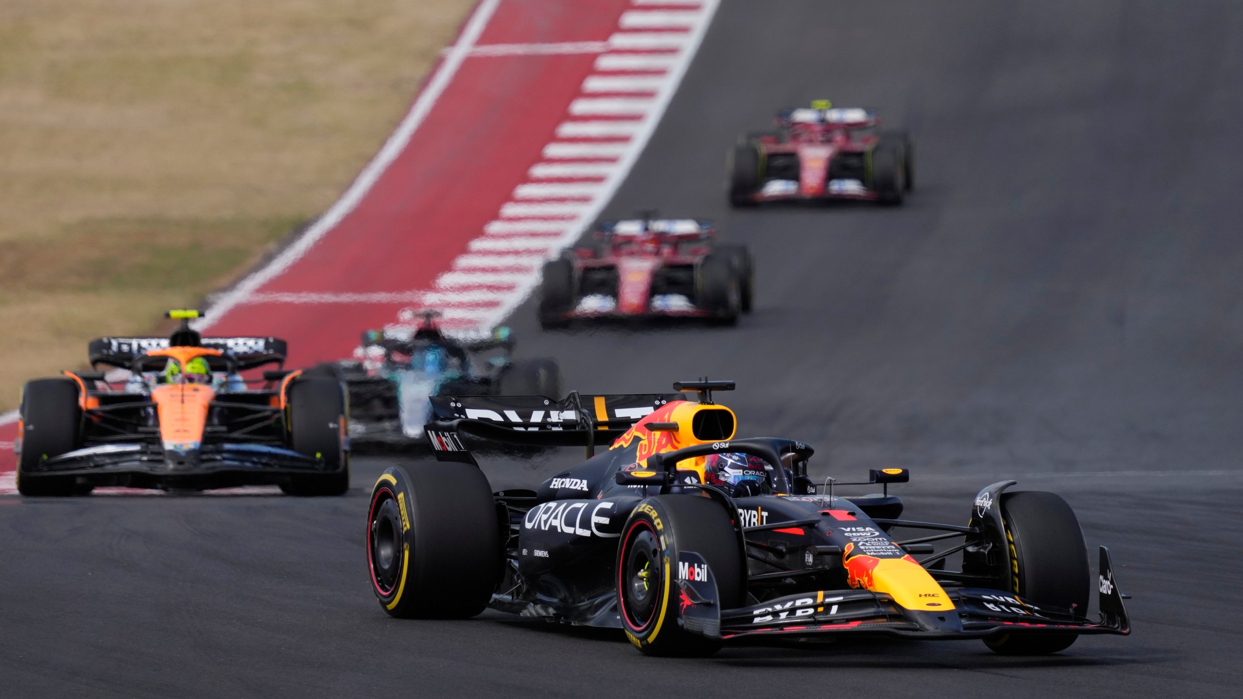 Red Bull driver Max Verstappen, of the Netherlands, steers into a turn during a sprint race ahead of the Formula One U.S. Grand Prix auto race at Circuit of the Americas, Saturday, Oct. 19, 2024, in Austin, Texas. (AP Photo/Eric Gay)