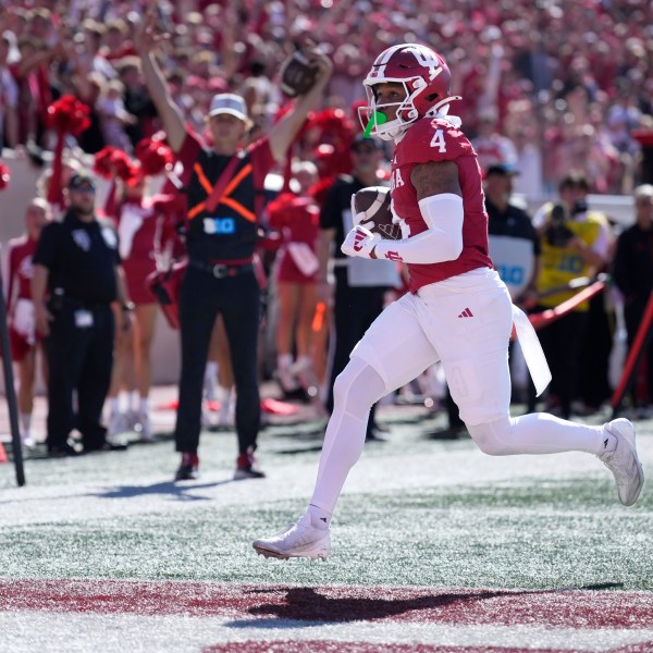 Indiana wide receiver Myles Price (4) scores a touchdown against Nebraska during the first half of an NCAA college football game in Bloomington, Ind., Saturday, Oct. 19, 2024. (AP Photo/AJ Mast)