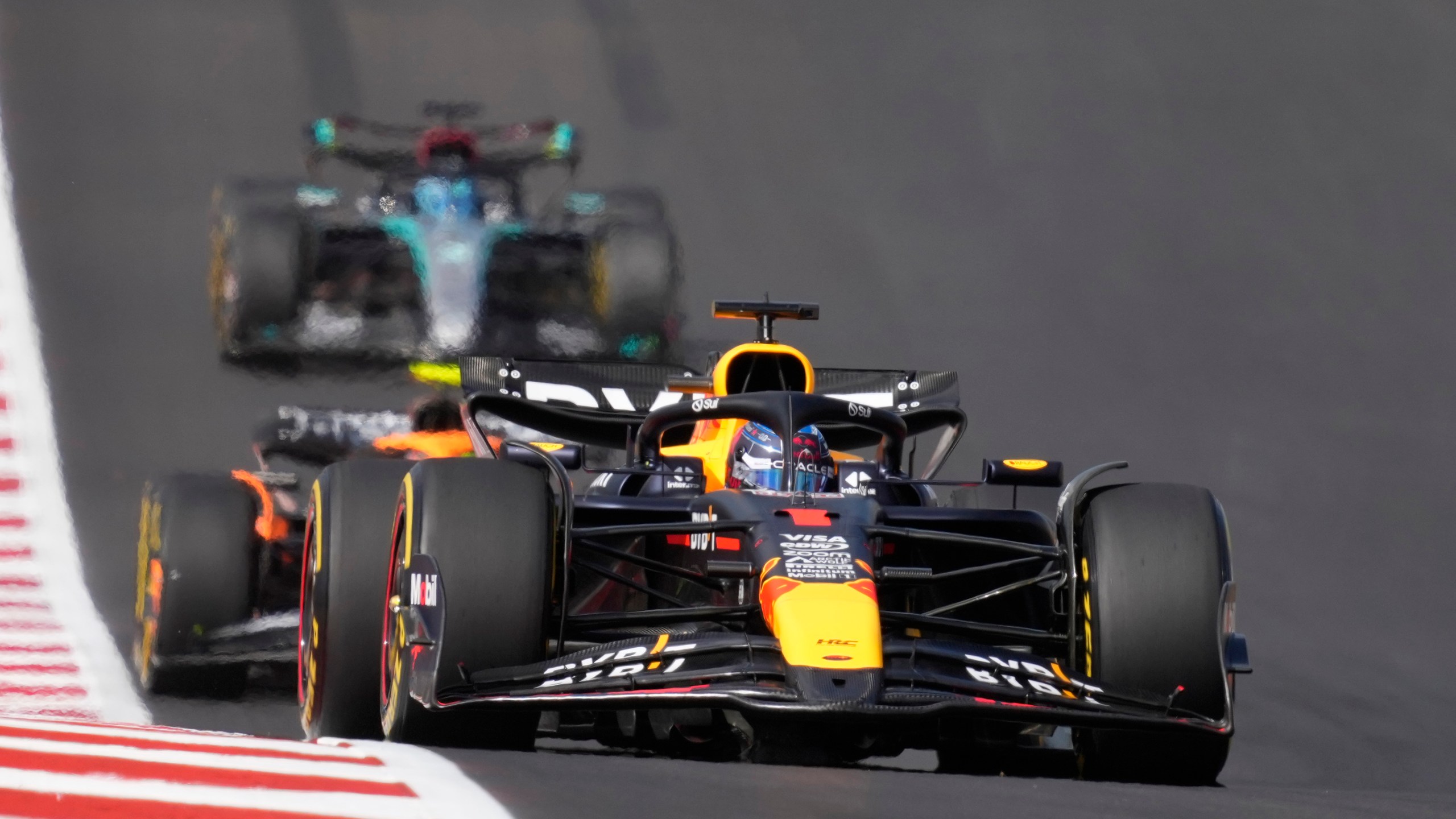 Red Bull driver Max Verstappen, of the Netherlands, steers into a turn during a sprint race ahead of the Formula One U.S. Grand Prix auto race at Circuit of the Americas, Saturday, Oct. 19, 2024, in Austin, Texas. (AP Photo/Eric Gay)