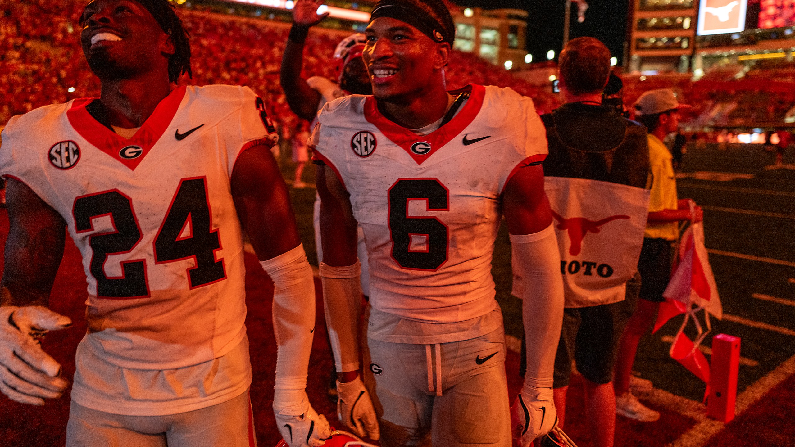 Georgia defensive backs Malaki Starks (24) and Daylen Everette (6) celebrate as they leave the field after Georgia defeated Texas during an NCAA college football game in Austin, Texas, Saturday, Oct. 19, 2024. (AP Photo/Rodolfo Gonzalez)