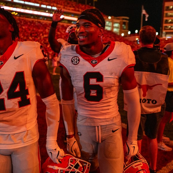 Georgia defensive backs Malaki Starks (24) and Daylen Everette (6) celebrate as they leave the field after Georgia defeated Texas during an NCAA college football game in Austin, Texas, Saturday, Oct. 19, 2024. (AP Photo/Rodolfo Gonzalez)