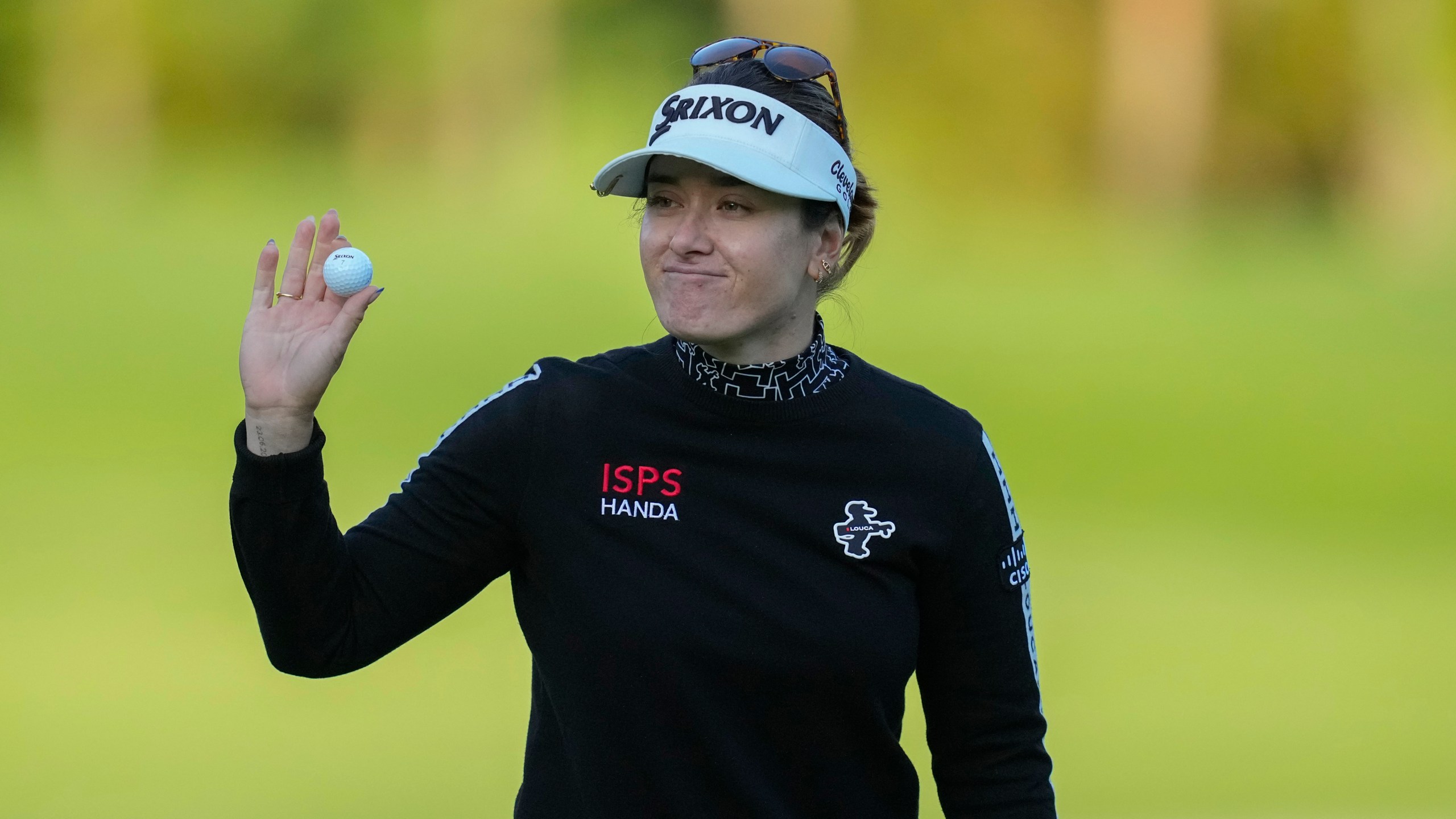 Hannah Green of Australia celebrates on the 18th hole after winning the LPGA Ladies Championship golf tournament at the Seowon Valley Country Club in Paju, South Korea, Sunday, Oct. 20, 2024. (AP Photo/Lee Jin-man)