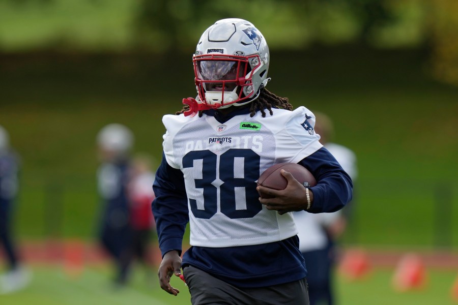 New England Patriots running back Rhamondre Stevenson (38) takes part in drills during NFL football practice, Friday, Oct. 18, 2024, in Harrow, England. (AP Photo/Steve Luciano)