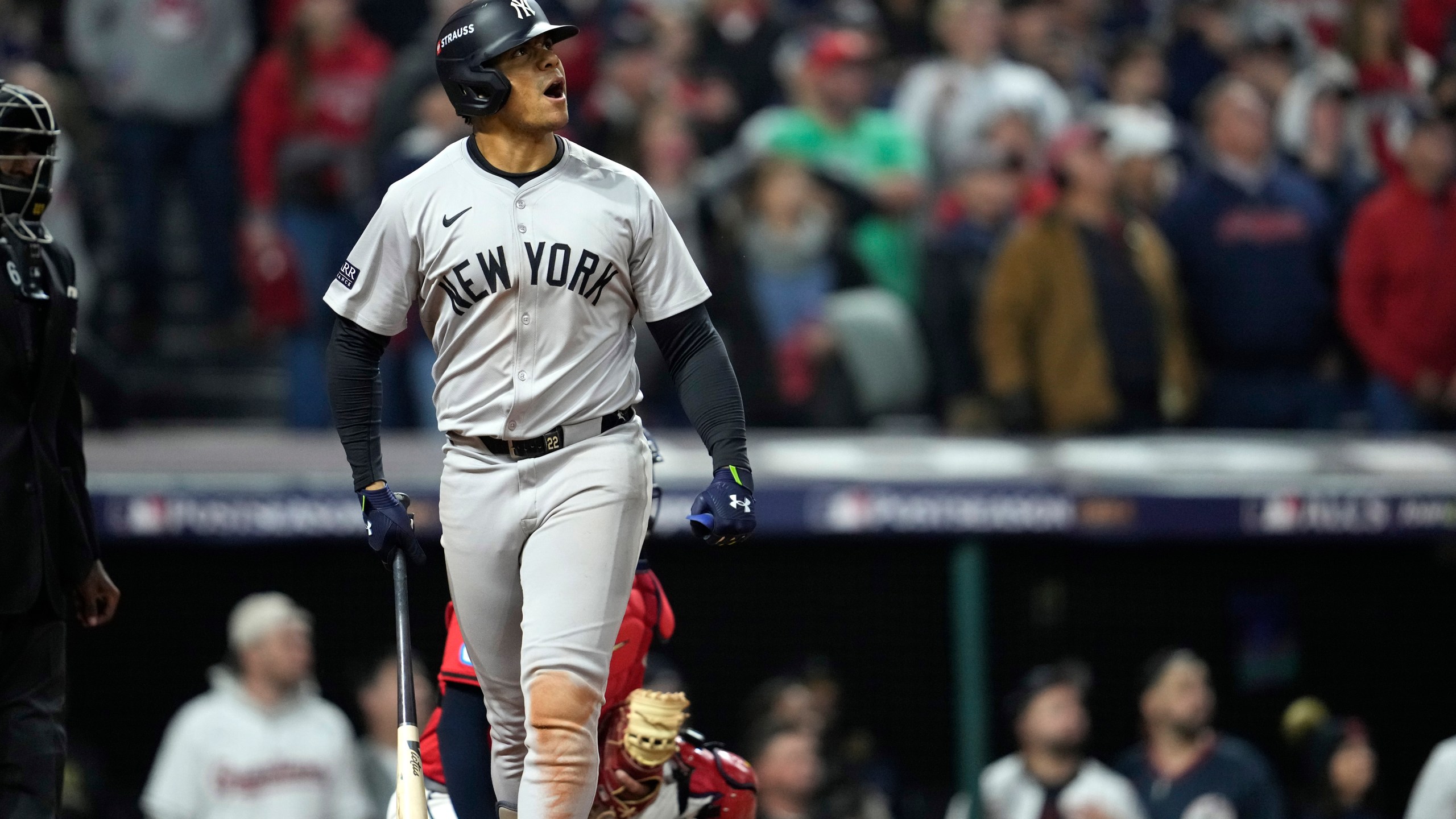 New York Yankees' Juan Soto watches his three-run home run against the Cleveland Guardians during the 10th inning in Game 5 of the baseball AL Championship Series Saturday, Oct. 19, 2024, in Cleveland. (AP Photo/Godofredo A. Vásquez)