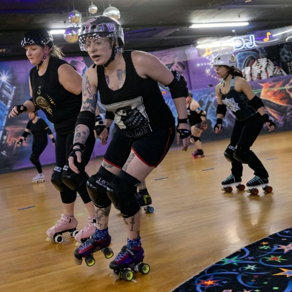 FILE - Members of the Long Island Roller Rebels practice, Mar. 19, 2023, at United Skates of America, in Seaford, NY. The Nassau County legislature, on New York's Long Island, has voted, Monday, June 24, 2024, to bar transgender female athletes from playing on girls' and women's teams at county-owned facilities after a bid to restrict trans athletes by executive order was thrown out in court. (AP Photo/Jeenah Moon, File)