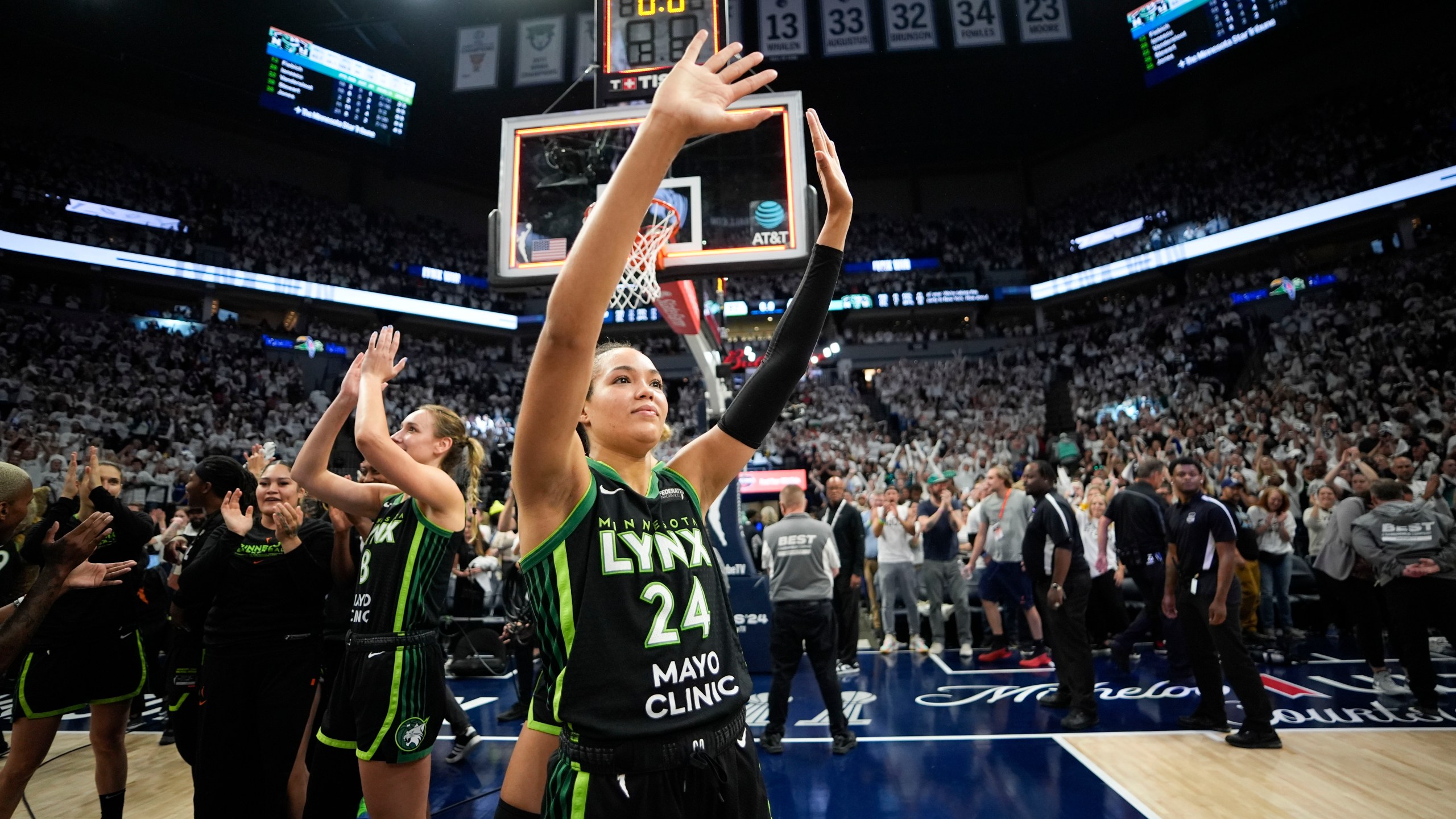 Minnesota Lynx forward Napheesa Collier (24) celebrates their victory over the New York Liberty after Game 4 of a WNBA basketball final playoff series, Friday, Oct. 18, 2024, in Minneapolis. The Lynx won 82-80, forcing a Game 5 in the series. (AP Photo/Abbie Parr)