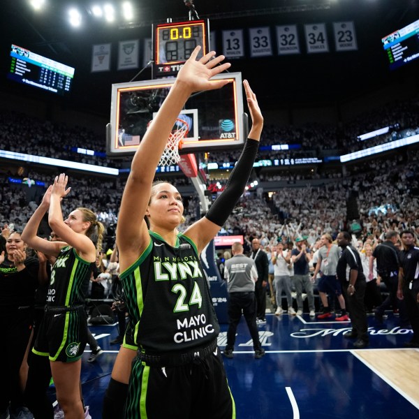 Minnesota Lynx forward Napheesa Collier (24) celebrates their victory over the New York Liberty after Game 4 of a WNBA basketball final playoff series, Friday, Oct. 18, 2024, in Minneapolis. The Lynx won 82-80, forcing a Game 5 in the series. (AP Photo/Abbie Parr)