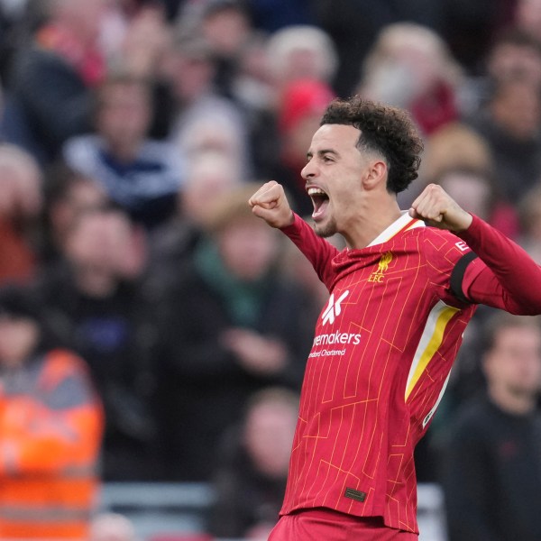 Liverpool's Curtis Jones celebrates after scoring his side's second goal during the English Premier League soccer match between Liverpool and Chelsea at Anfield Stadium, Liverpool, England, Sunday, Oct. 20, 2024. (AP Photo/Jon Super)