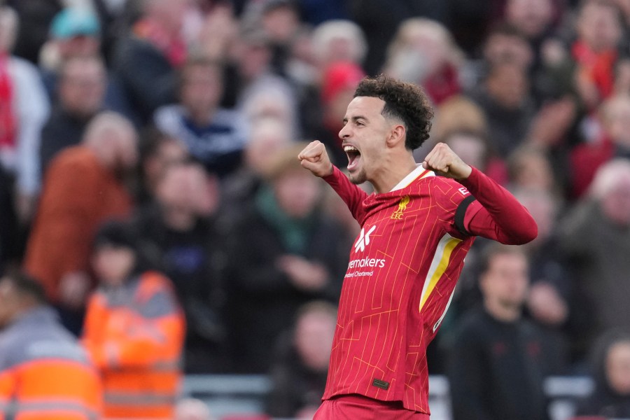 Liverpool's Curtis Jones celebrates after scoring his side's second goal during the English Premier League soccer match between Liverpool and Chelsea at Anfield Stadium, Liverpool, England, Sunday, Oct. 20, 2024. (AP Photo/Jon Super)