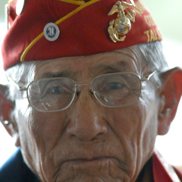 FILE - Navajo Code Talker John Kinsel Sr., of Lukachukai, Ariz., listens as his comrades speak of their WWII experiences Tuesday Aug. 14, 2007, in Window Rock, Ariz. (AP Photo/Donovan Quintero, File)