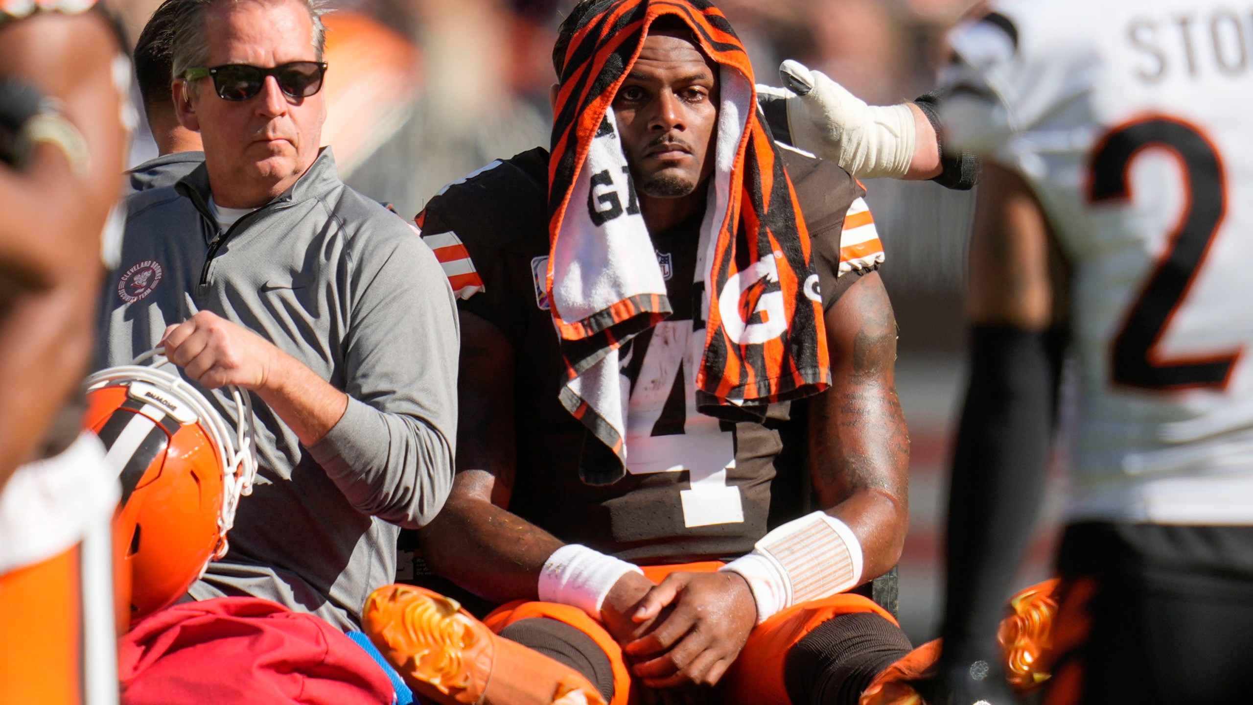 Cleveland Browns quarterback Deshaun Watson (4) is carted off the field after being injured in the first half of an NFL football game against the Cincinnati Bengals, Sunday, Oct. 20, 2024, in Cleveland. (AP Photo/Sue Ogrocki)