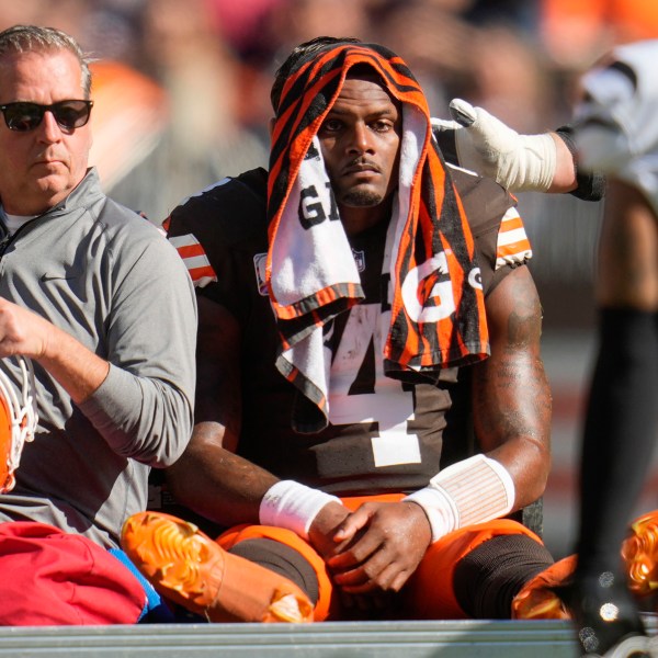 Cleveland Browns quarterback Deshaun Watson (4) is carted off the field after being injured in the first half of an NFL football game against the Cincinnati Bengals, Sunday, Oct. 20, 2024, in Cleveland. (AP Photo/Sue Ogrocki)