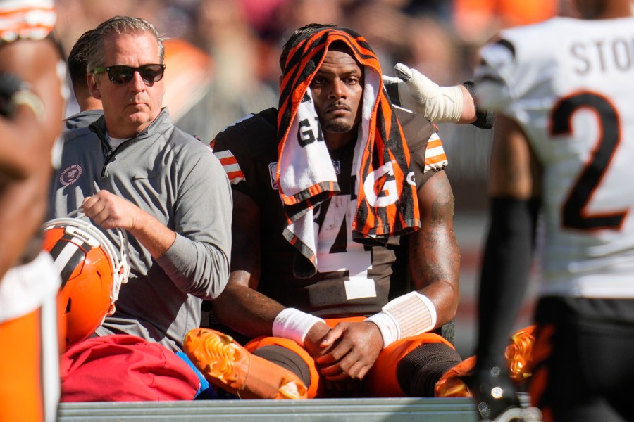 Cleveland Browns quarterback Deshaun Watson (4) is carted off the field after being injured in the first half of an NFL football game against the Cincinnati Bengals, Sunday, Oct. 20, 2024, in Cleveland. (AP Photo/Sue Ogrocki)