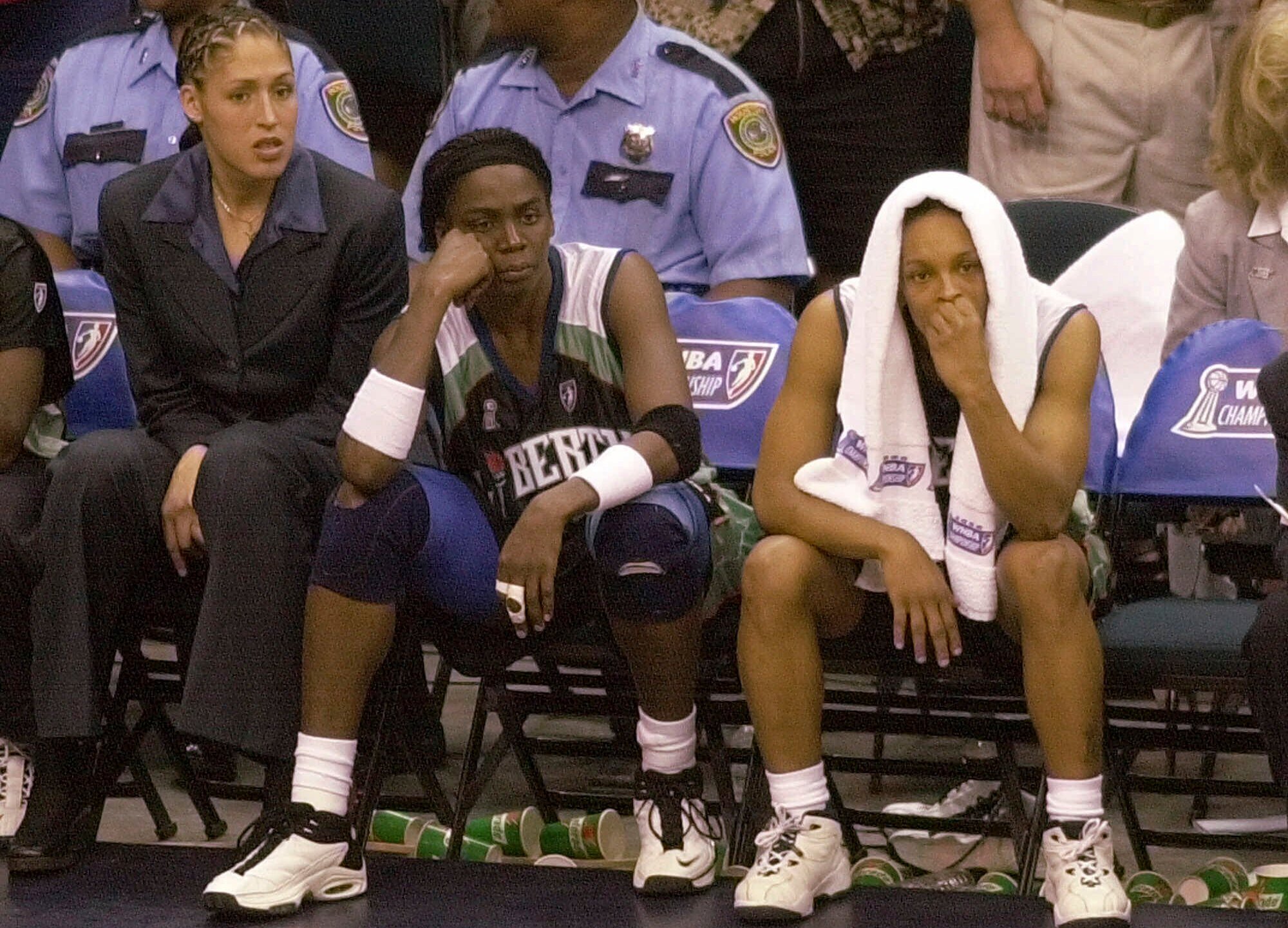 FILE - New York Liberty's Rebecca Lobo, left, Tari Phillips, center, and Teresa Weatherspoon watch from the bench in the final seconds against the Houston Comets in Game 2 of the WNBA Championship game, Aug. 26, 2000, in Houston. (AP Photo/Pat Sullivan, File)