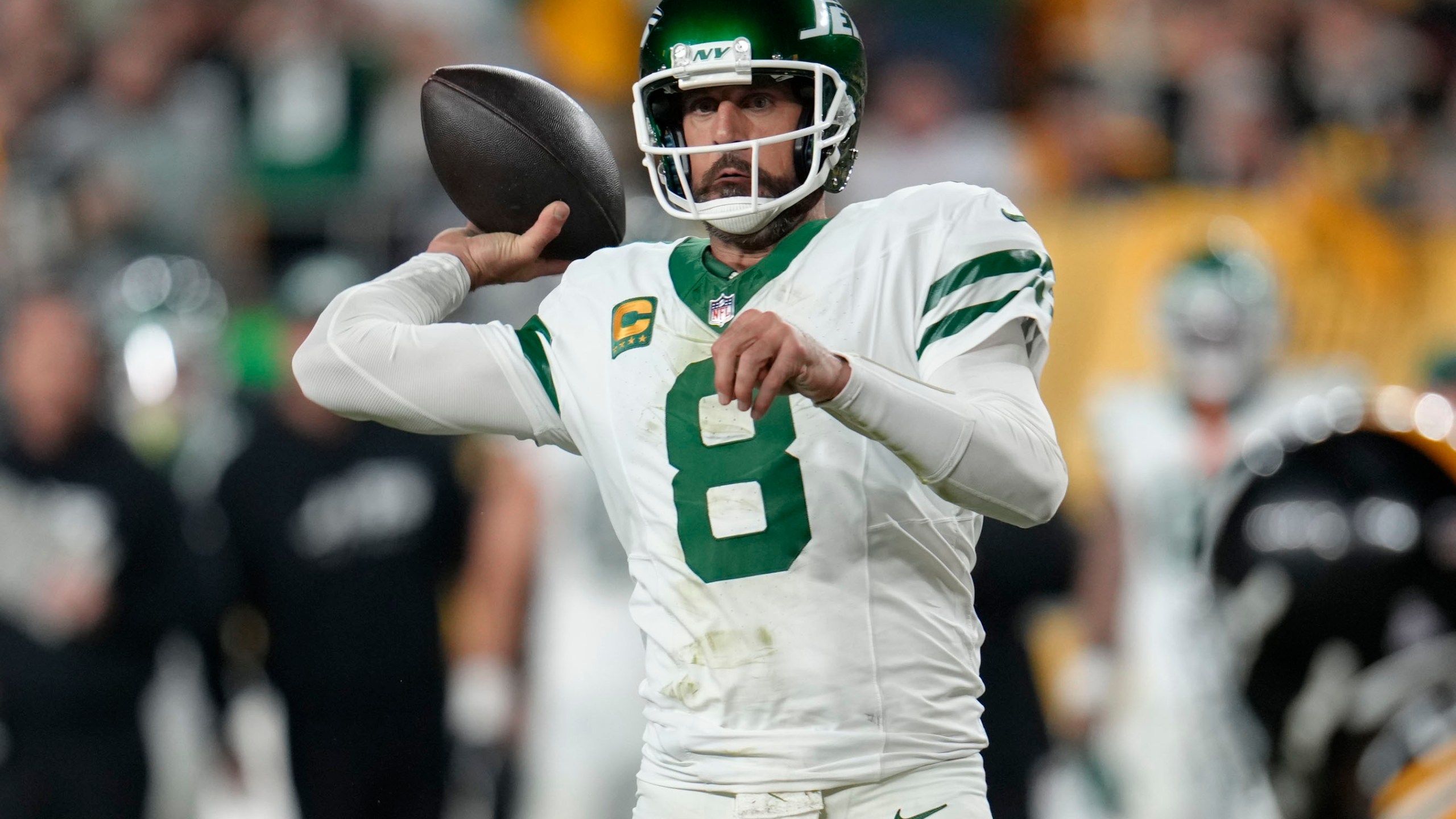 New York Jets quarterback Aaron Rodgers (8) passes in the first half of an NFL football game against the Pittsburgh Steelers in Pittsburgh, Sunday, Oct. 20, 2024. (AP Photo/Gene J. Puskar)