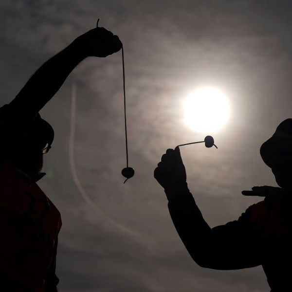 Competitors take part in the annual World Conker Championships at the Shuckburgh Arms in Southwick, Peterborough, England, Sunday Oct. 13, 2024. (Jacob King/PA via AP)