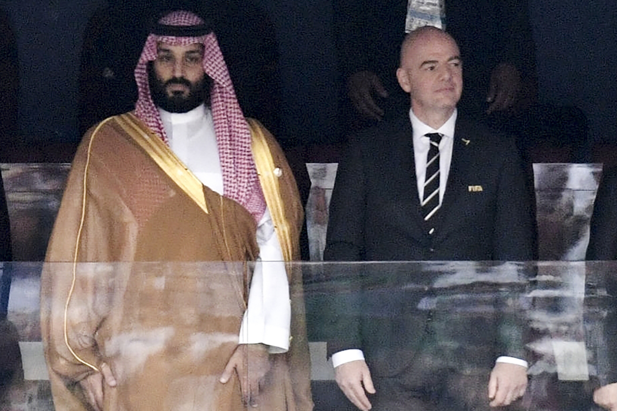 FILE - Saudi Arabia Crown Prince Mohammed bin Salman, left, and FIFA President Gianni Infantino, stand for the anthem prior to the match between Russia and Saudi Arabia which opened the 2018 soccer World Cup at the Luzhniki stadium in Moscow, Russia, on June 14, 2018. (Alexei Nikolsky, Sputnik, Kremlin Pool Photo via AP, File)