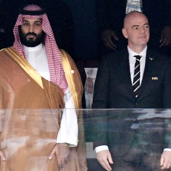 FILE - Saudi Arabia Crown Prince Mohammed bin Salman, left, and FIFA President Gianni Infantino, stand for the anthem prior to the match between Russia and Saudi Arabia which opened the 2018 soccer World Cup at the Luzhniki stadium in Moscow, Russia, on June 14, 2018. (Alexei Nikolsky, Sputnik, Kremlin Pool Photo via AP, File)