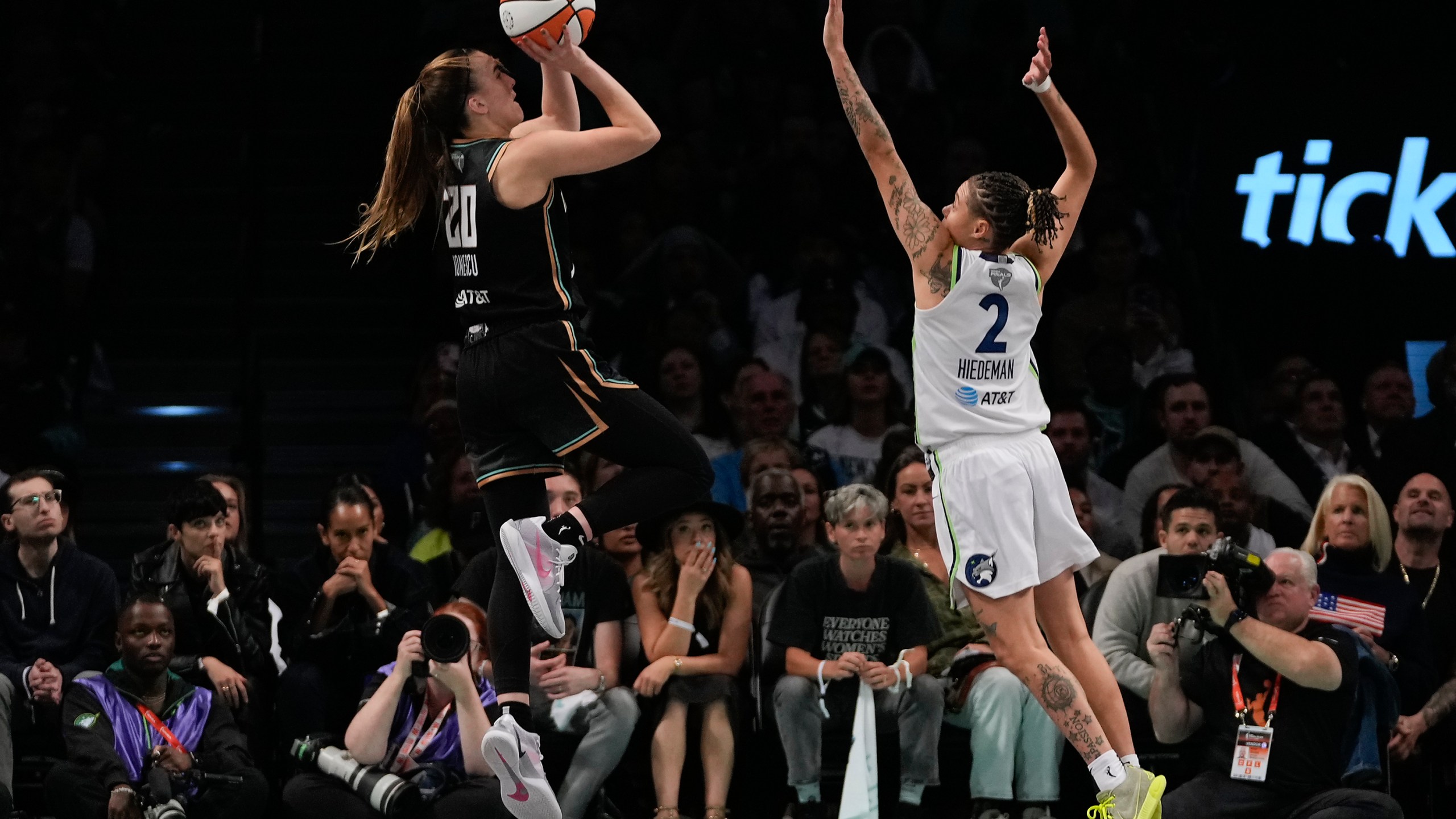 New York Liberty guard Sabrina Ionescu (20) puts up a shot against Minnesota Lynx guard Natisha Hiedeman (2) during the fourth quarter of Game 5 of the WNBA basketball final series, Sunday, Oct. 20, 2024, in New York. (AP Photo/Pamela Smith)