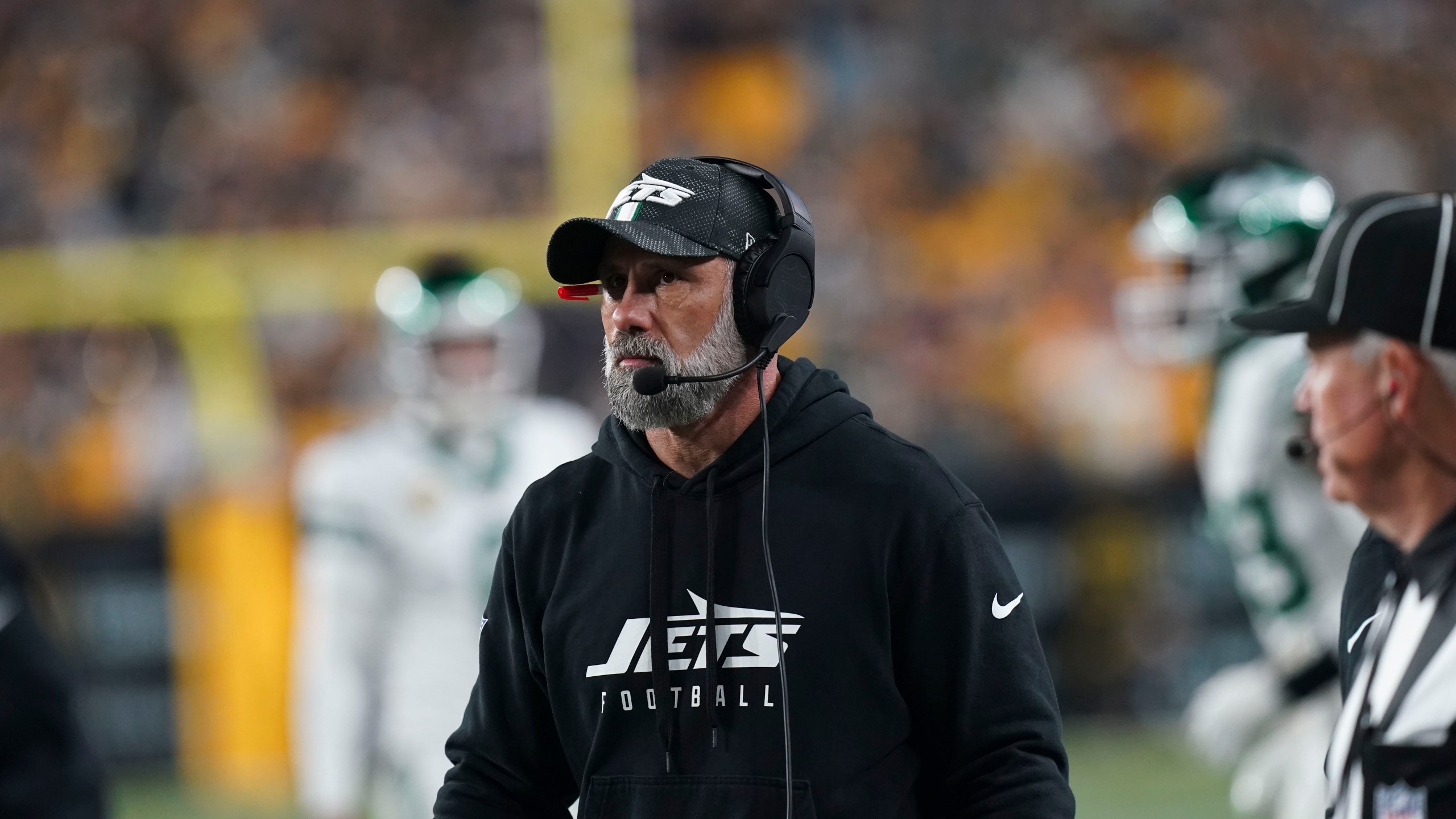 New York Jets head coach Jeff Ulbrich watches fro the sideline in the second half of an NFL football game against the Pittsburgh Steelers in Pittsburgh, Sunday, Oct. 20, 2024. (AP Photo/Matt Freed)