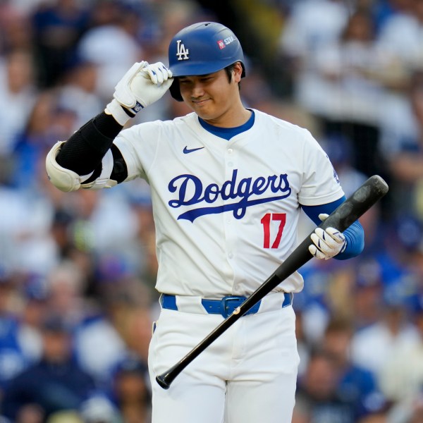 Los Angeles Dodgers' Shohei Ohtani bats against the New York Mets during the first inning in Game 6 of a baseball NL Championship Series, Sunday, Oct. 20, 2024, in Los Angeles. (AP Photo/Julio Cortez)