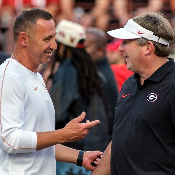 Texas head coach Steve Sarkisian, left, and Georgia head coach Kirby Smart talk during the pregame of an NCAA college football game in Austin, Texas, Saturday, Oct. 19, 2024. (AP Photo/Rodolfo Gonzalez)