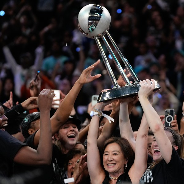 The New York Liberty hold up the championship trophy after defeating the Minnesota Lynx in Game 5 of the WNBA basketball final series, Sunday, Oct. 20, 2024, in New York. (AP Photo/Pamela Smith)