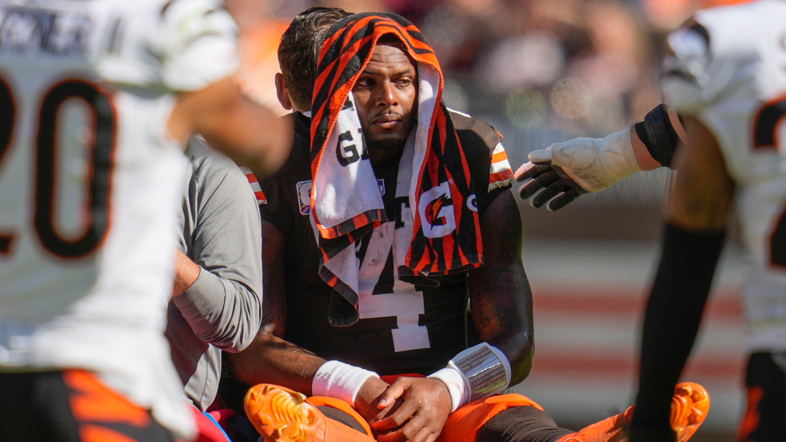 Cleveland Browns quarterback Deshaun Watson (4) is carted off the field after being injured in the first half of an NFL football game against the Cincinnati Bengals, Sunday, Oct. 20, 2024, in Cleveland. (AP Photo/Sue Ogrocki)