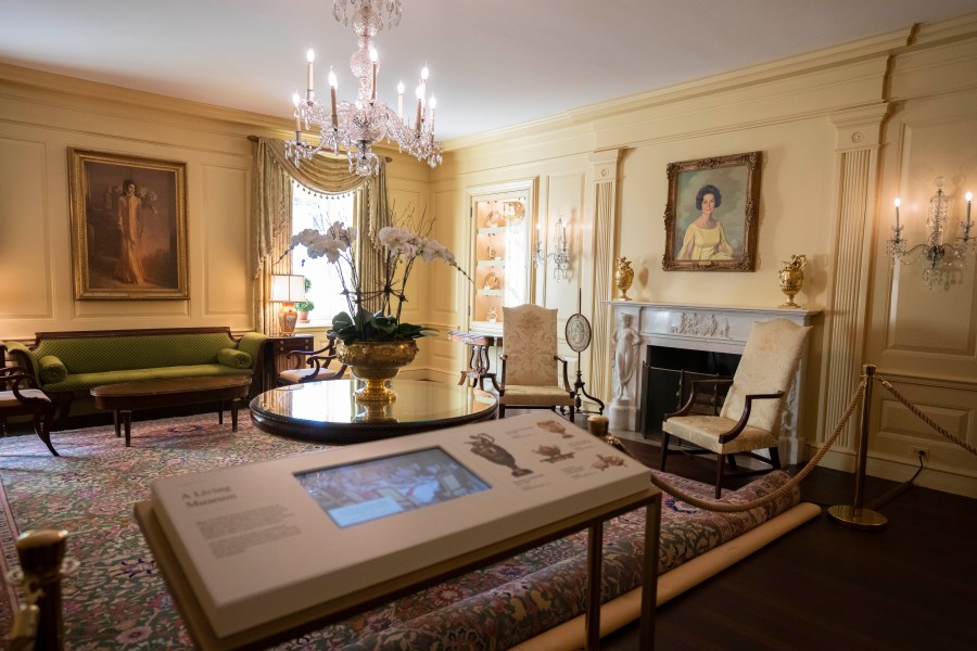 First ladies' portraits including former first lady Jacqueline Kennedy Onassis, left, and former first lady Lady Bird Johnson, right, adorn the Vermeil Room on Friday, Oct. 18, 2024. (AP Photo/Manuel Balce Ceneta)