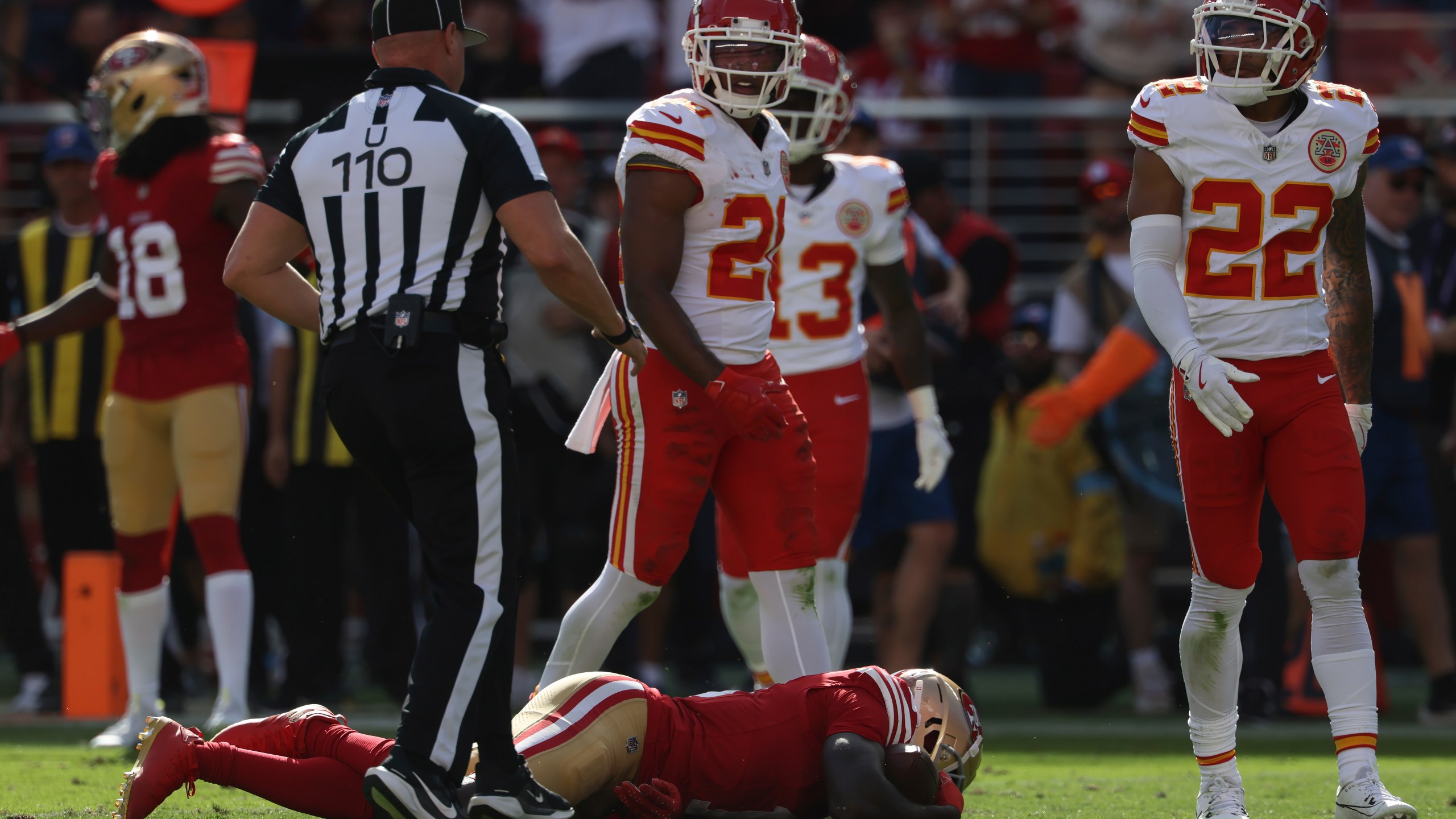 San Francisco 49ers wide receiver Brandon Aiyuk, bottom, remains on the field after being hit during the first half of an NFL football game against the Kansas City Chiefs in Santa Clara, Calif., Sunday, Oct. 20, 2024. (AP Photo/Jed Jacobsohn)