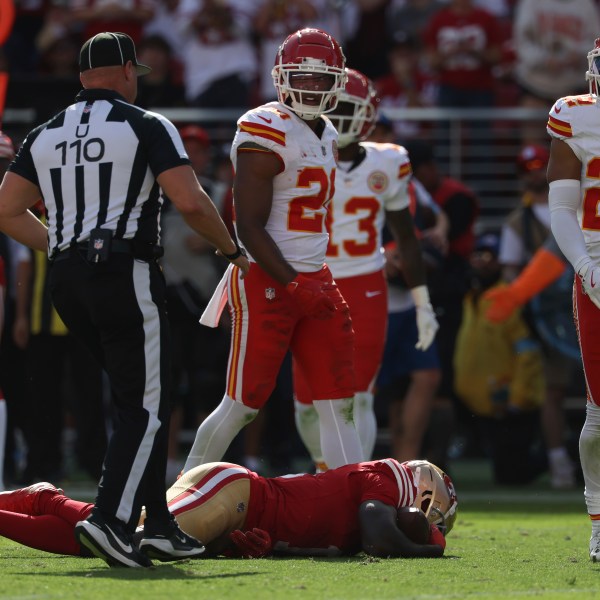 San Francisco 49ers wide receiver Brandon Aiyuk, bottom, remains on the field after being hit during the first half of an NFL football game against the Kansas City Chiefs in Santa Clara, Calif., Sunday, Oct. 20, 2024. (AP Photo/Jed Jacobsohn)