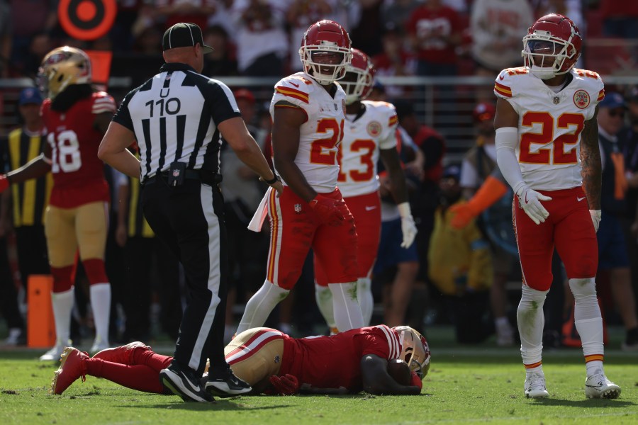 San Francisco 49ers wide receiver Brandon Aiyuk, bottom, remains on the field after being hit during the first half of an NFL football game against the Kansas City Chiefs in Santa Clara, Calif., Sunday, Oct. 20, 2024. (AP Photo/Jed Jacobsohn)