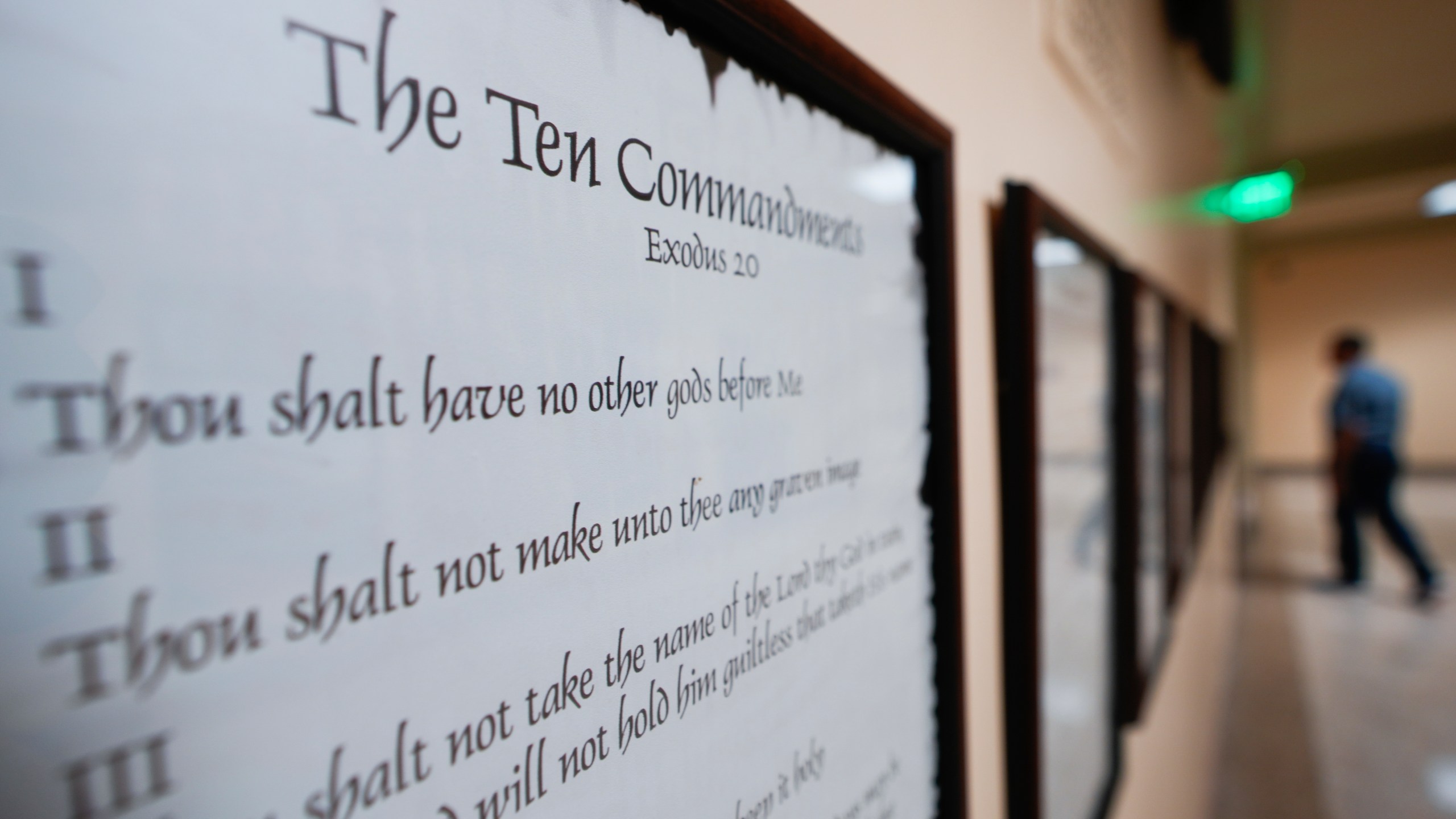 FILE - A copy of the Ten Commandments is posted along with other historical documents in a hallway of the Georgia Capitol, June 20, 2024, in Atlanta. (AP Photo/John Bazemore, File)