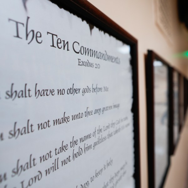 FILE - A copy of the Ten Commandments is posted along with other historical documents in a hallway of the Georgia Capitol, June 20, 2024, in Atlanta. (AP Photo/John Bazemore, File)