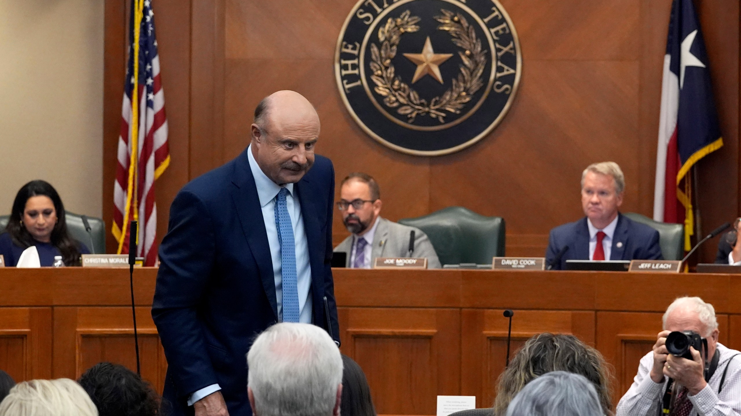 Dr. Phil McGraw stands as he leaves the room after giving testimony to a committee discussing the case of death row inmate Robert Roberson, Monday, Oct. 21, 2024, in Austin, Texas. (AP Photo/Tony Gutierrez)