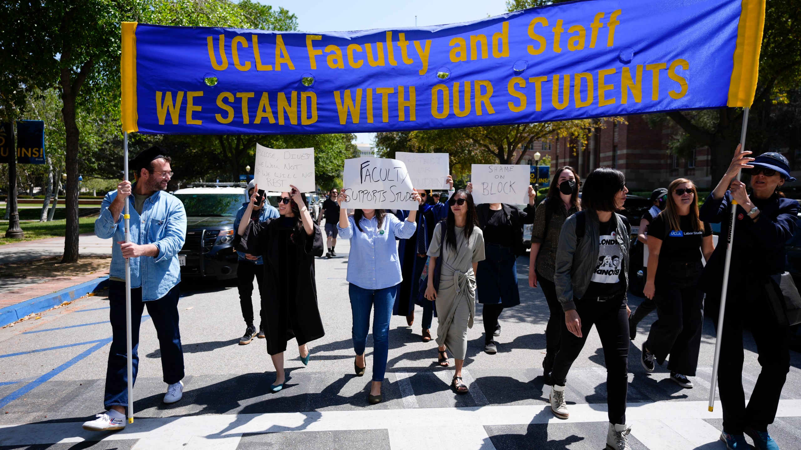 FILE - Faculty and staff march on the UCLA campus, after nighttime clashes between Pro-Israel and Pro-Palestinian groups, Wednesday, May 1, 2024, in Los Angeles. (AP Photo/Jae C. Hong, File)