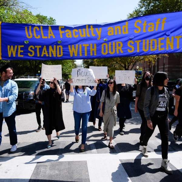 FILE - Faculty and staff march on the UCLA campus, after nighttime clashes between Pro-Israel and Pro-Palestinian groups, Wednesday, May 1, 2024, in Los Angeles. (AP Photo/Jae C. Hong, File)