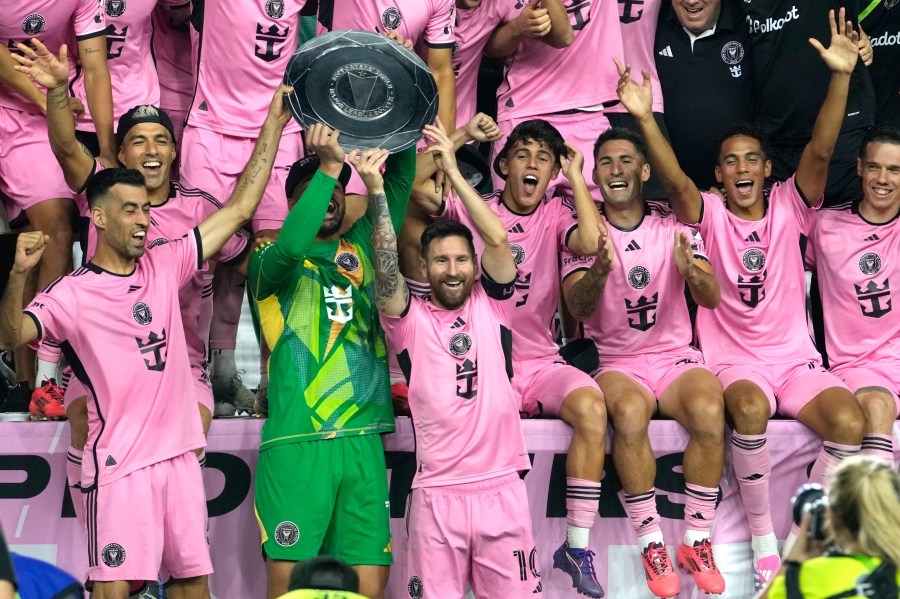 Inter Miami forward Lionel Messi (10) celebrates with his teammates during a ceremony for winning the Supporters' Shield after an MLS soccer match against the New England Revolution, Saturday, Oct. 19, 2024, in Fort Lauderdale, Fla. (AP Photo/Lynne Sladky)