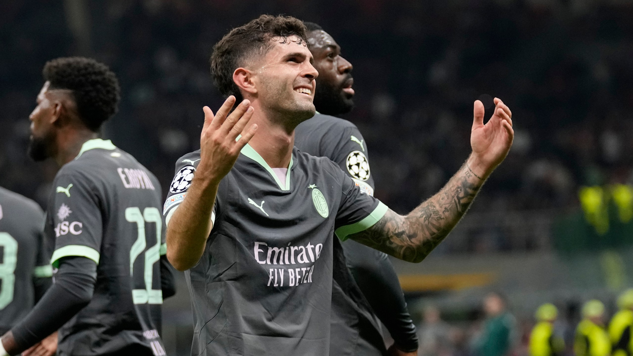 AC Milan's Christian Pulisic reacts after scoring the opening goal of his team during the Champions League opening phase soccer match between AC Milan and Club Brugge at the San Siro stadium in Milan, Italy, Tuesday, Oct. 22, 2024. (AP Photo/Antonio Calani)