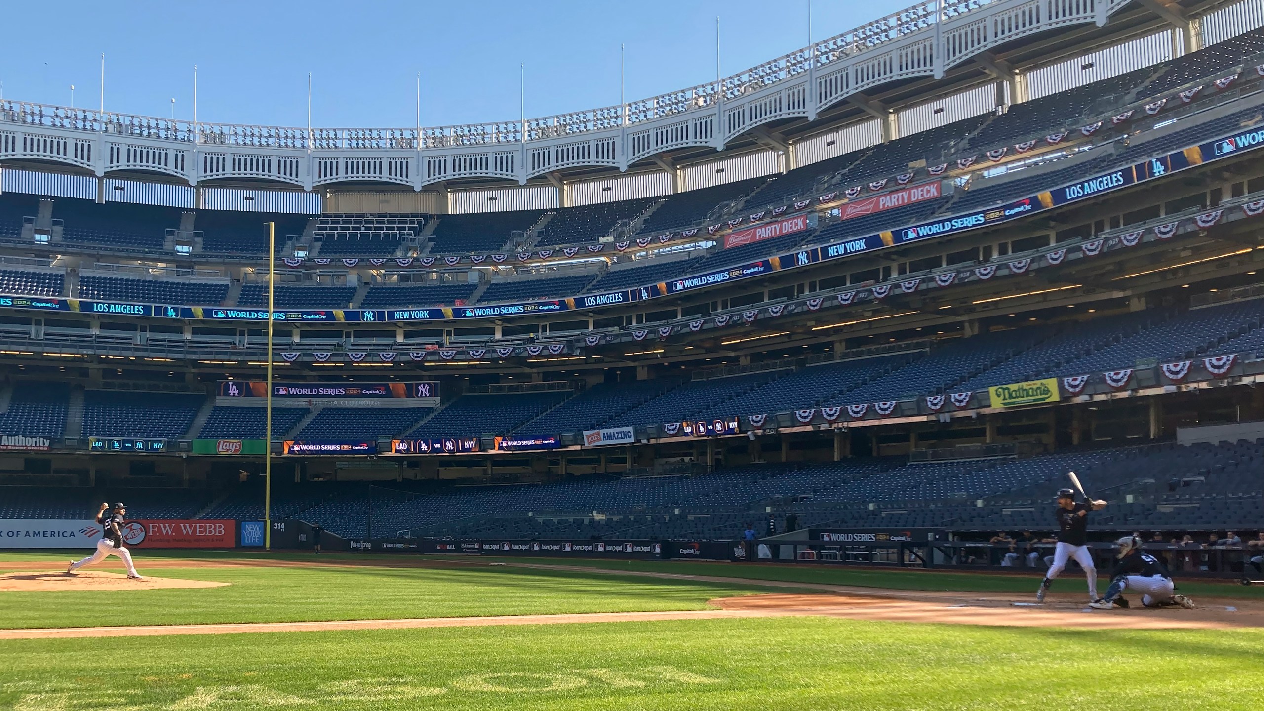 New York Yankees' Nester Cortes throws batting practice to Yankees' Austin Wells, Tuesday, Oct. 22, 2024. (AP Photo/Rom Blum)