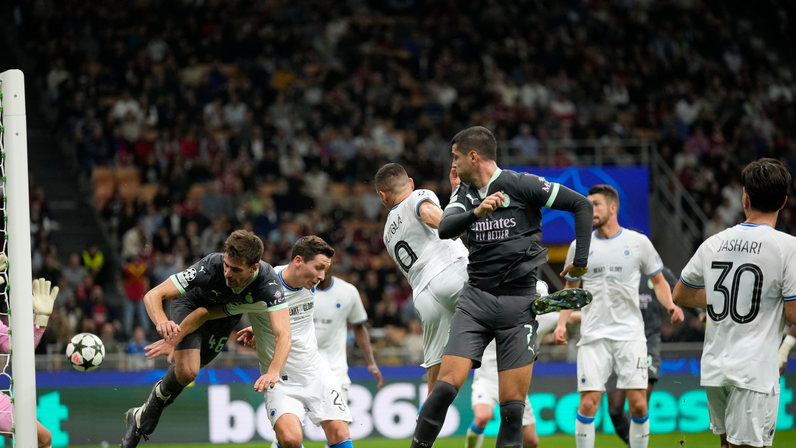 AC Milan's Christian Pulisic, not seen, scores direct from the corner his side's first goal during the Champions League opening phase soccer match between AC Milan and Club Brugge at the San Siro stadium in Milan, Italy, Tuesday, Oct. 22, 2024. (AP Photo/Antonio Calani)