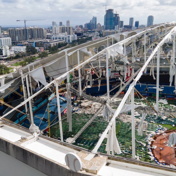 The roof of the Tropicana Field is damaged the morning after Hurricane Milton hit the region, Thursday, Oct. 10, 2024, in St. Petersburg, Fla. (AP Photo/Julio Cortez)