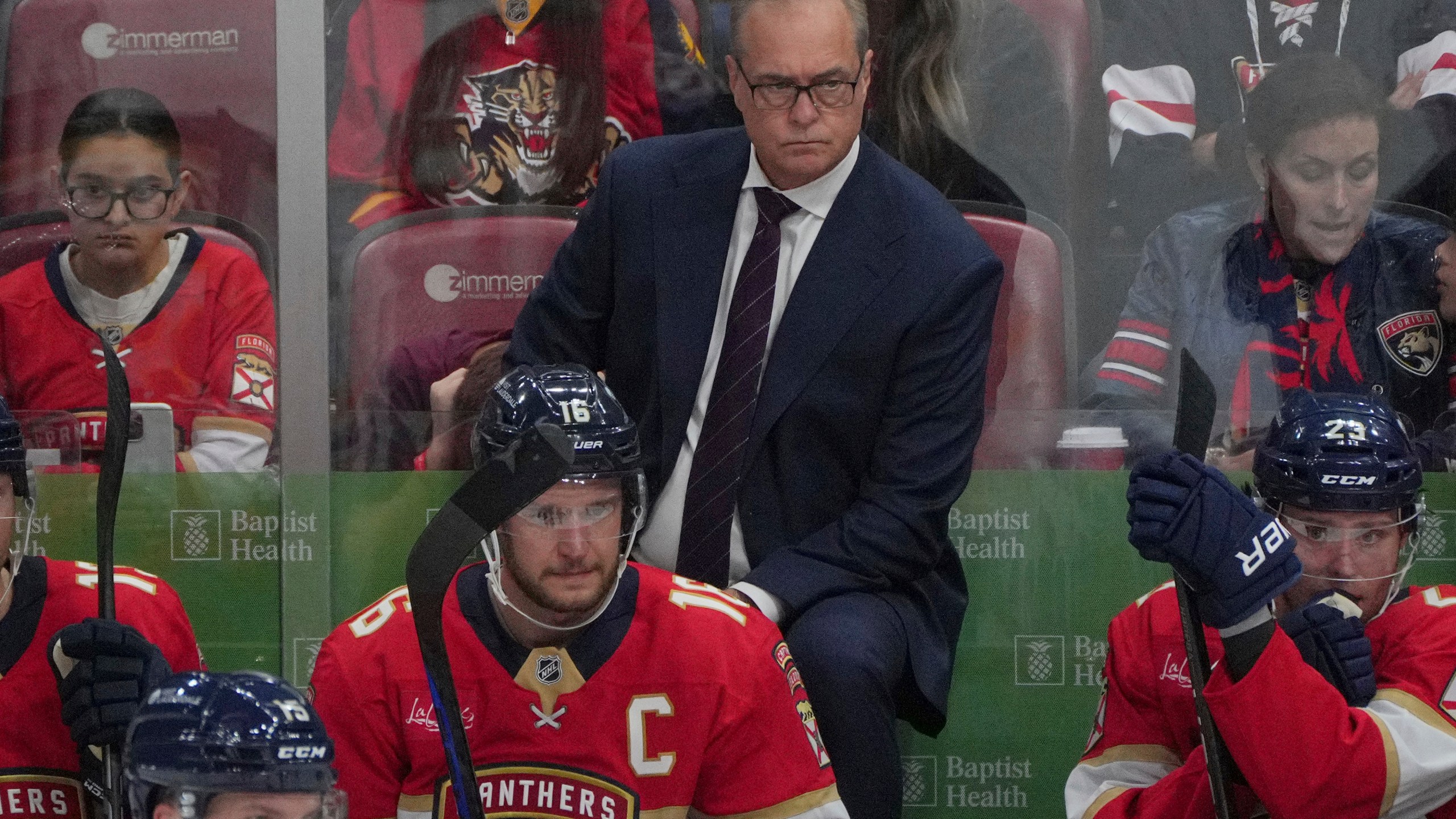 Florida Panthers head coach Paul Maurice keeps an eye on his team during the third period of an NHL hockey game against the Boston Bruins, Tuesday, Oct. 8, 2024, in Sunrise, Fla. (AP Photo/Jim Rassol)