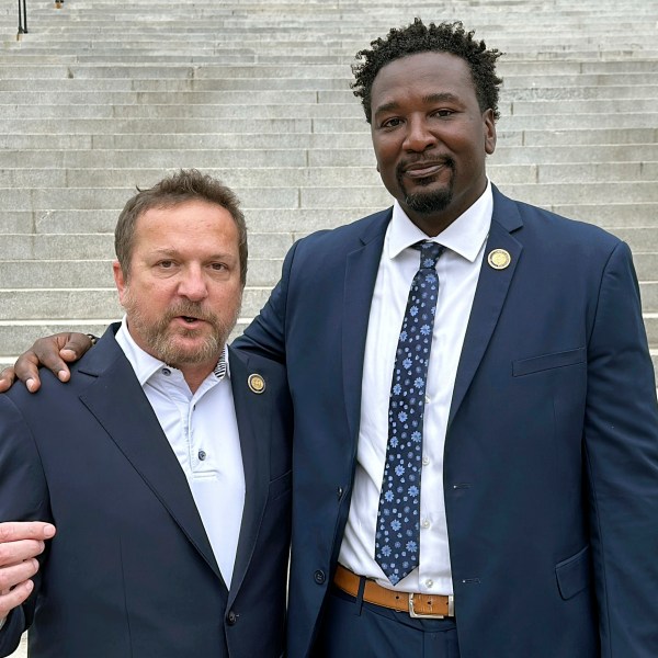 South Carolina state Reps. Brandon Cox, R-Goose Creek, left, and Jermaine Johnson, D-Columbia, right talk about their efforts to honor Robert Smalls, who will soon be the first African American individual with a statue at the South Carolina Statehouse, Friday, Sept. 13, 2024, in Columbia, S.C. (AP Photo/Jeffrey Collins)