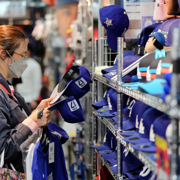 A customer shops around for goods related to Shohei Ohtani of the Los Angeles Dodgers at a sporting goods store, "SELECTION," in Shinjuku district Wednesday, Oct. 23, 2024 in Tokyo. (AP Photo/Eugene Hoshiko)