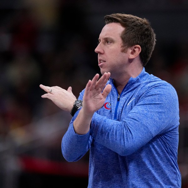 FILE - Washington Mystics head coach Eric Thibault signals to his team as they play against the Indiana Fever in the first half of a WNBA basketball game in Indianapolis, July 10, 2024. (AP Photo/Michael Conroy, File)