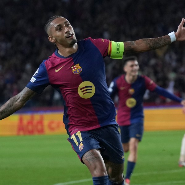 Barcelona's Raphinha celebrates after scoring his side's third goal during the Champions League opening phase soccer match between Barcelona and Bayern Munich at the Lluis Companys Olympic Stadium in Barcelona, Spain, Wednesday, Oct. 23, 2024. (AP Photo/Emilio Morenatti)